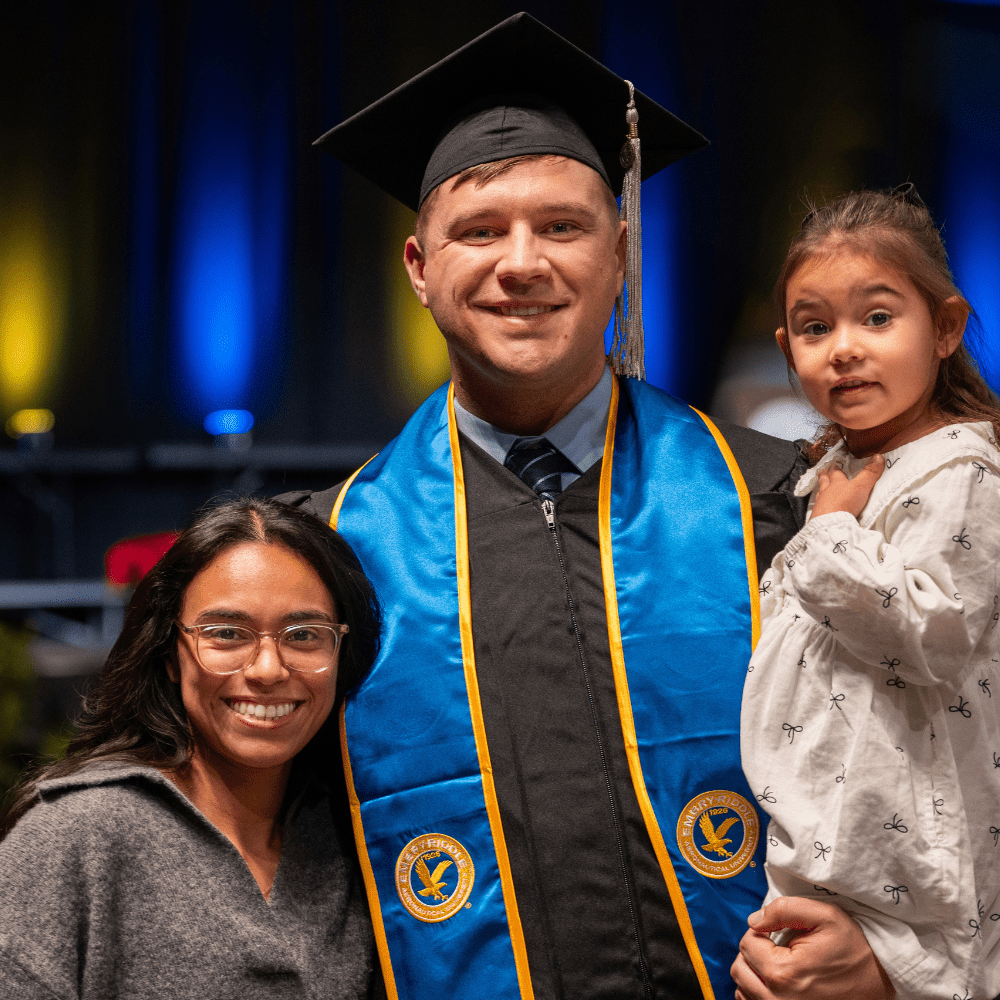 A graduate and their family at graduation.